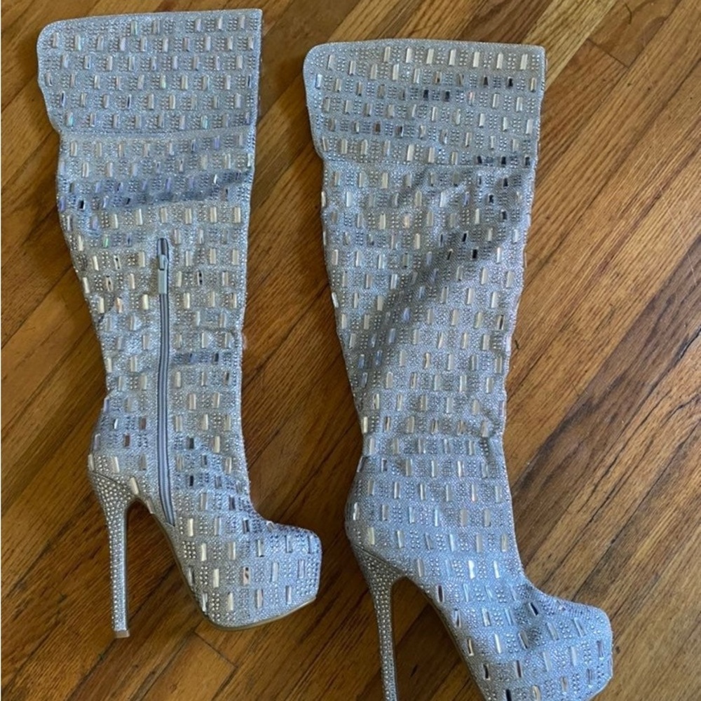 Silver knee high platform boots with mirrored type panels. Side zip, never worn.